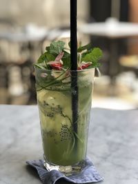 Close-up of drink on glass table