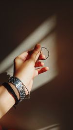 Close-up of woman hand holding eyeglasses