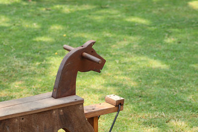 Wooden toy on grass at back yard