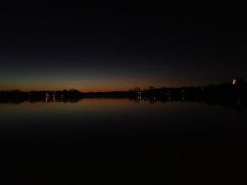 Scenic view of sea against clear sky at night