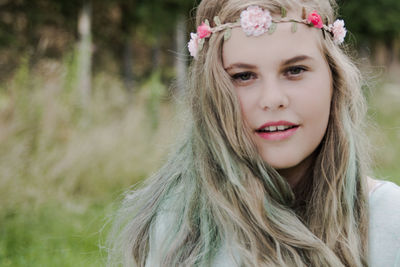 Portrait of beautiful woman at park