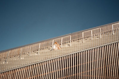 Low angle view of building against clear blue sky