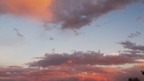 Low angle view of dramatic sky during sunset