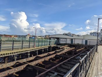 Train on railroad tracks against sky