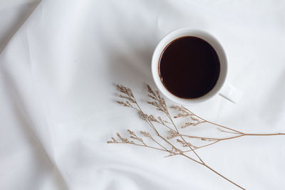 High angle view of coffee cup on table