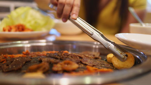 Close-up of person preparing food