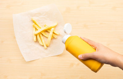 High angle view of person preparing food on table