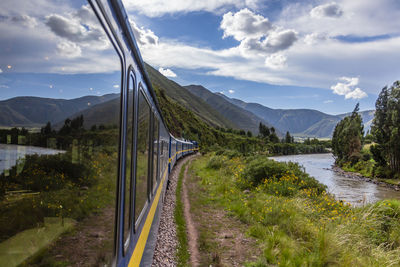 Panoramic view of road by mountains against sky