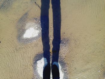 Low section of people standing in water