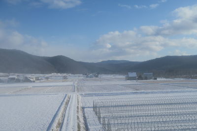 Scenic view of landscape and mountains against sky