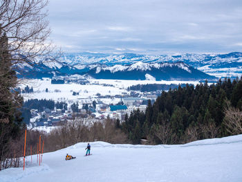 Scenic view of snow covered mountains against sky