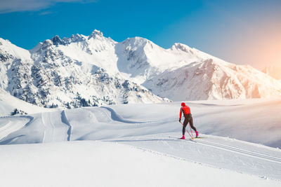 Man skiing on snowcapped mountain