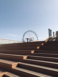 Low angle view of ferris wheel against sky