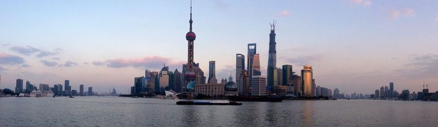 Panoramic view of buildings in city against sky