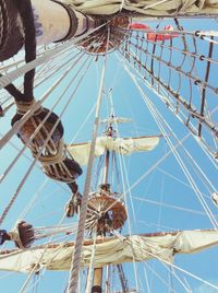 Low angle view of mast against sky on sunny day