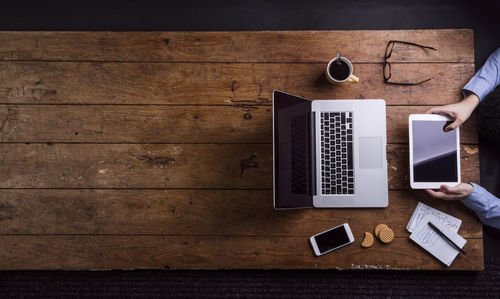 Man working with tablet pc at desk