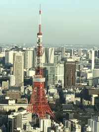 Modern buildings in city against clear sky