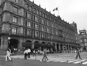 People in front of historical building