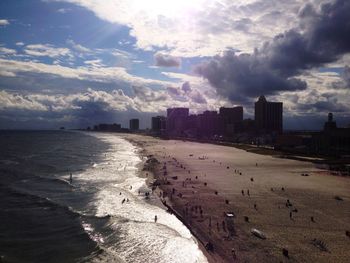 View of beach against cloudy sky