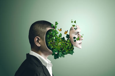 Digital composite image of man against gray background