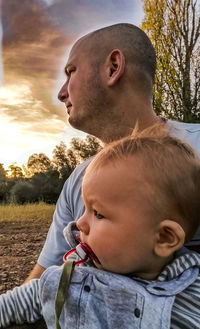 Portrait of cute baby and son