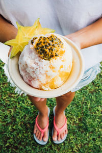 Low section of woman holding food