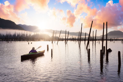 Scenic view of lake against sky during sunset