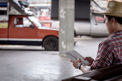 Close-up of man using mobile phone