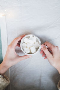 Midsection of woman holding ice cream