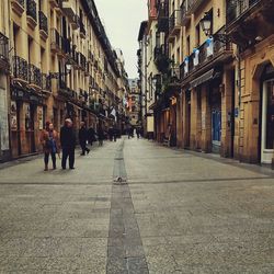 People walking on street in city