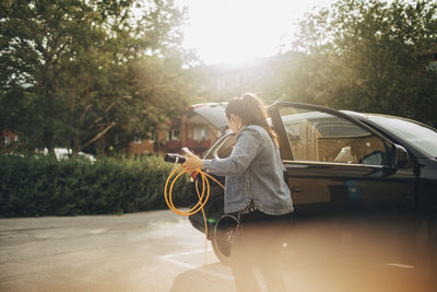 Rear view of woman in car