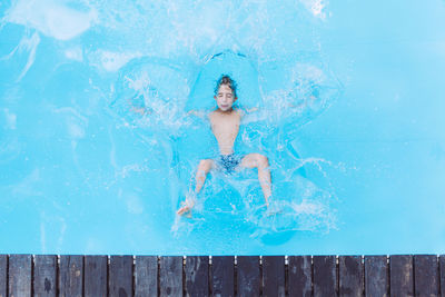 High angle view of boy in swimming pool