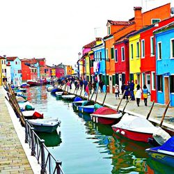 Boats moored in canal