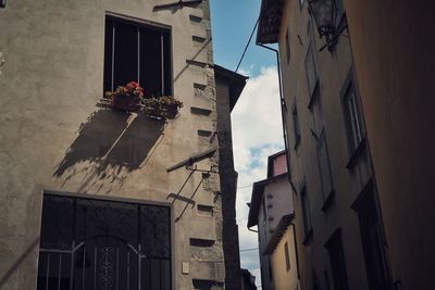 Low angle view of buildings in city against sky