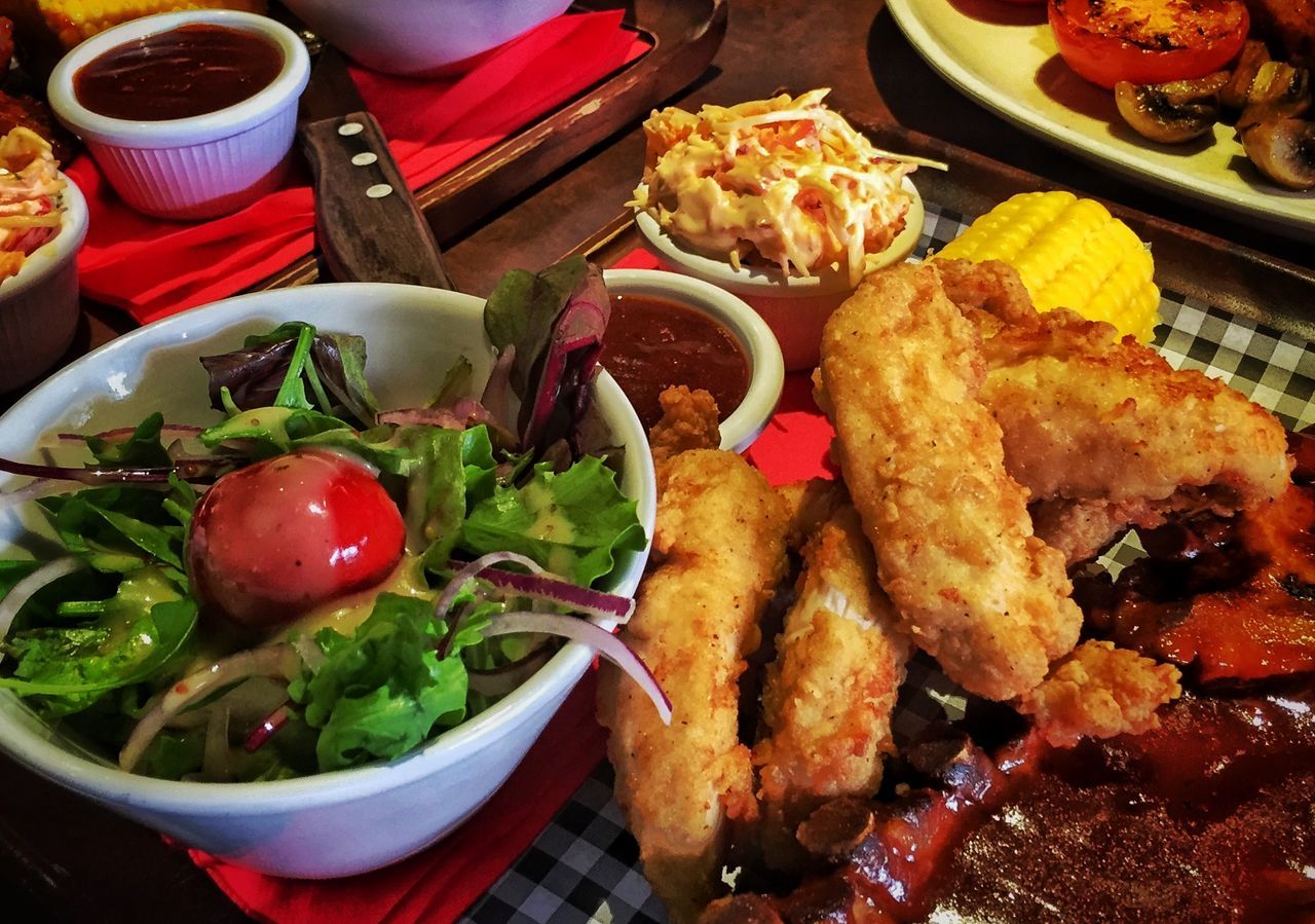 food and drink, food, freshness, indoors, healthy eating, ready-to-eat, still life, plate, meat, meal, table, serving size, vegetable, high angle view, tomato, salad, seafood, close-up, bowl, restaurant