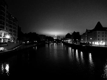 Canal in front of old town at night