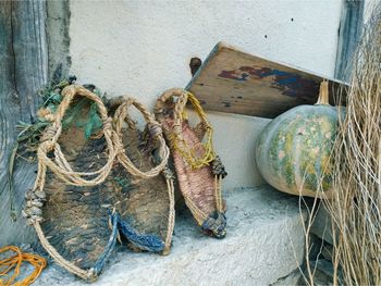 Pumpkin and fishing equipment against wall