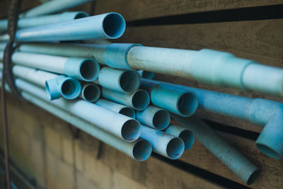 Close-up of blue pipes on table