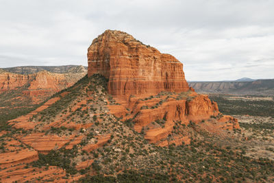 Rock formations on landscape against sky