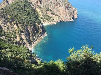 High angle view of cliff by sea