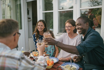 Group of people drinking glass on table