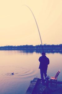 Man fishing in lake