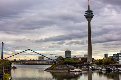 View of bridge over river against cloudy sky