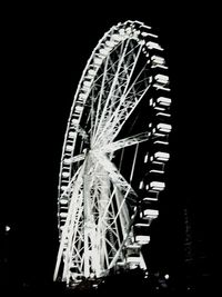 Low angle view of illuminated ferris wheel