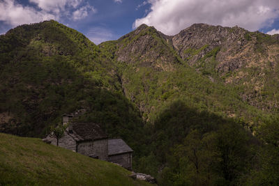 Scenic view of mountains against cloudy sky