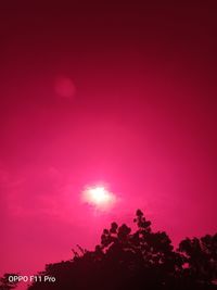 Low angle view of silhouette trees against sky during sunset