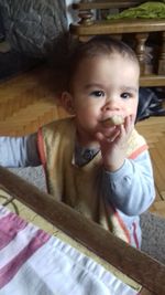 Portrait of cute baby boy at home