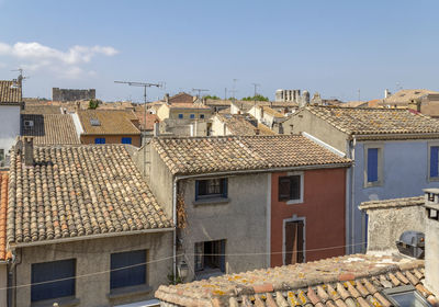 Houses in town against sky