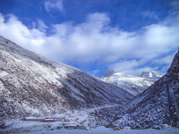 Scenic view of mountains against sky during winter