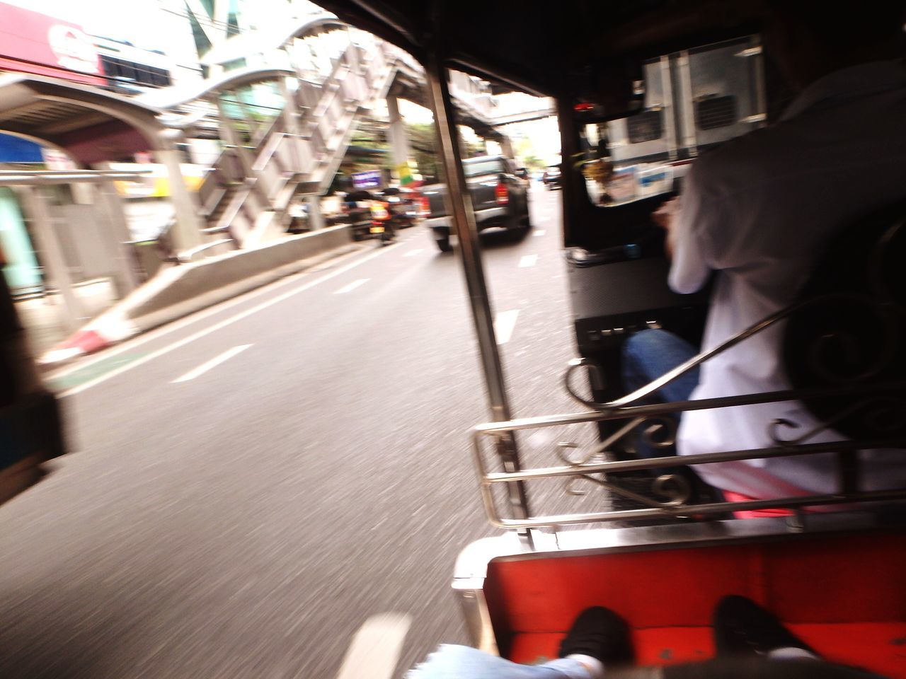 CLOSE-UP OF CARS ON ROAD